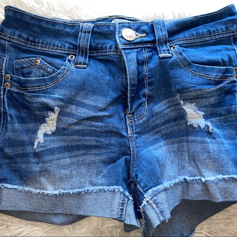 YMI mid rise jean shorts. Size small. They shape your butt so good!